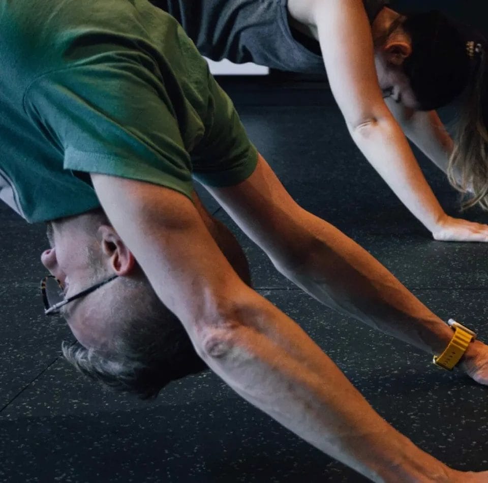 Man and woman stretching